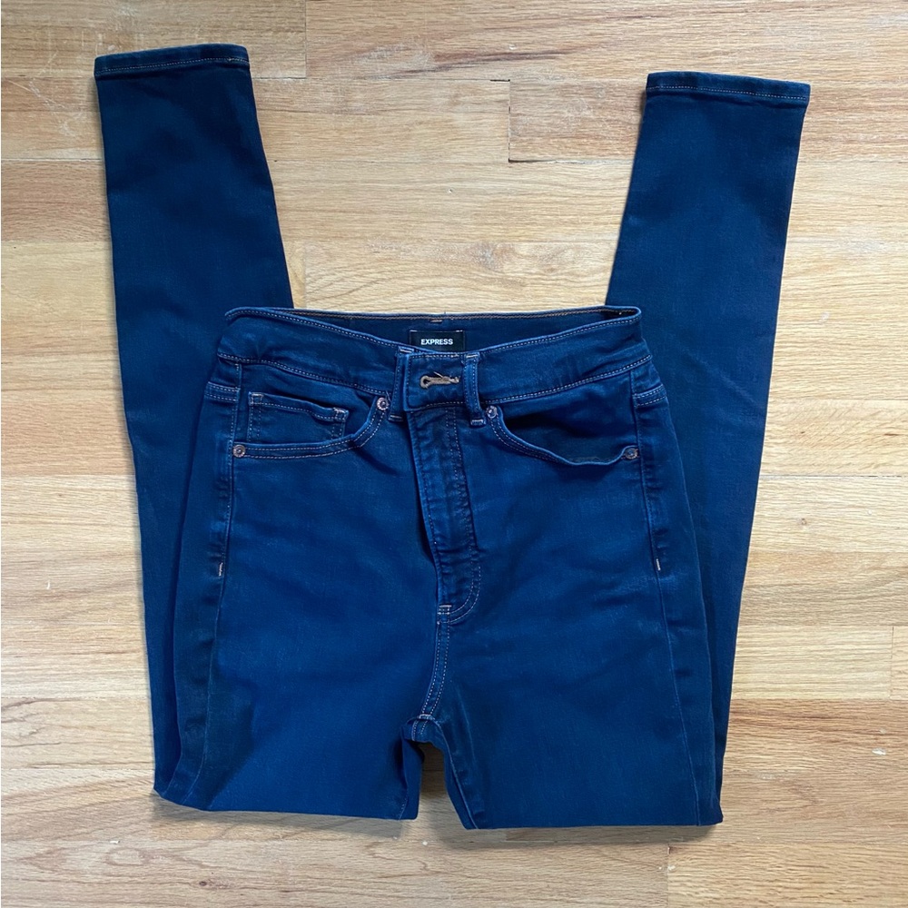 Express women’s dark wash high rise skinny jeans.